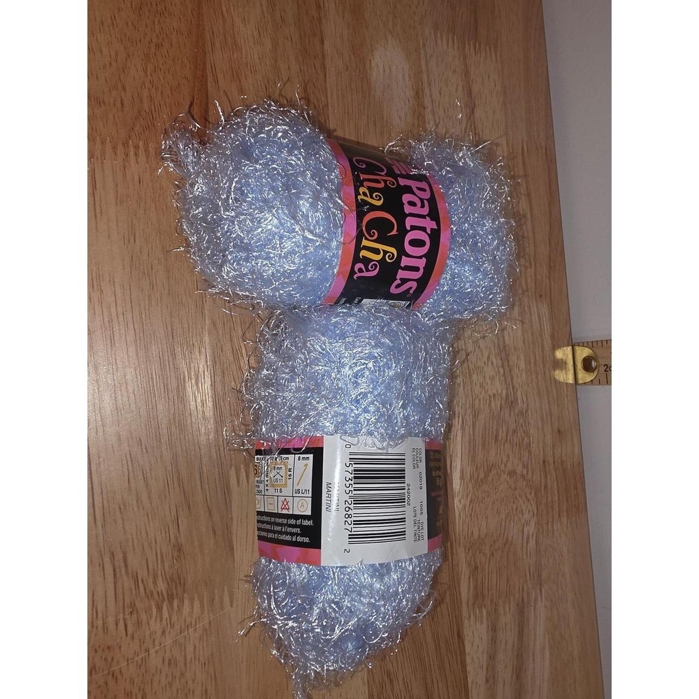 Two skeins Patons Cha Cha Yarn, a textured, novelty eyelash Martini baby blue